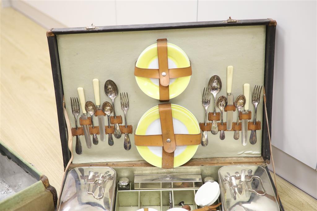 A vintage French picnic set and canvas picnic hamper